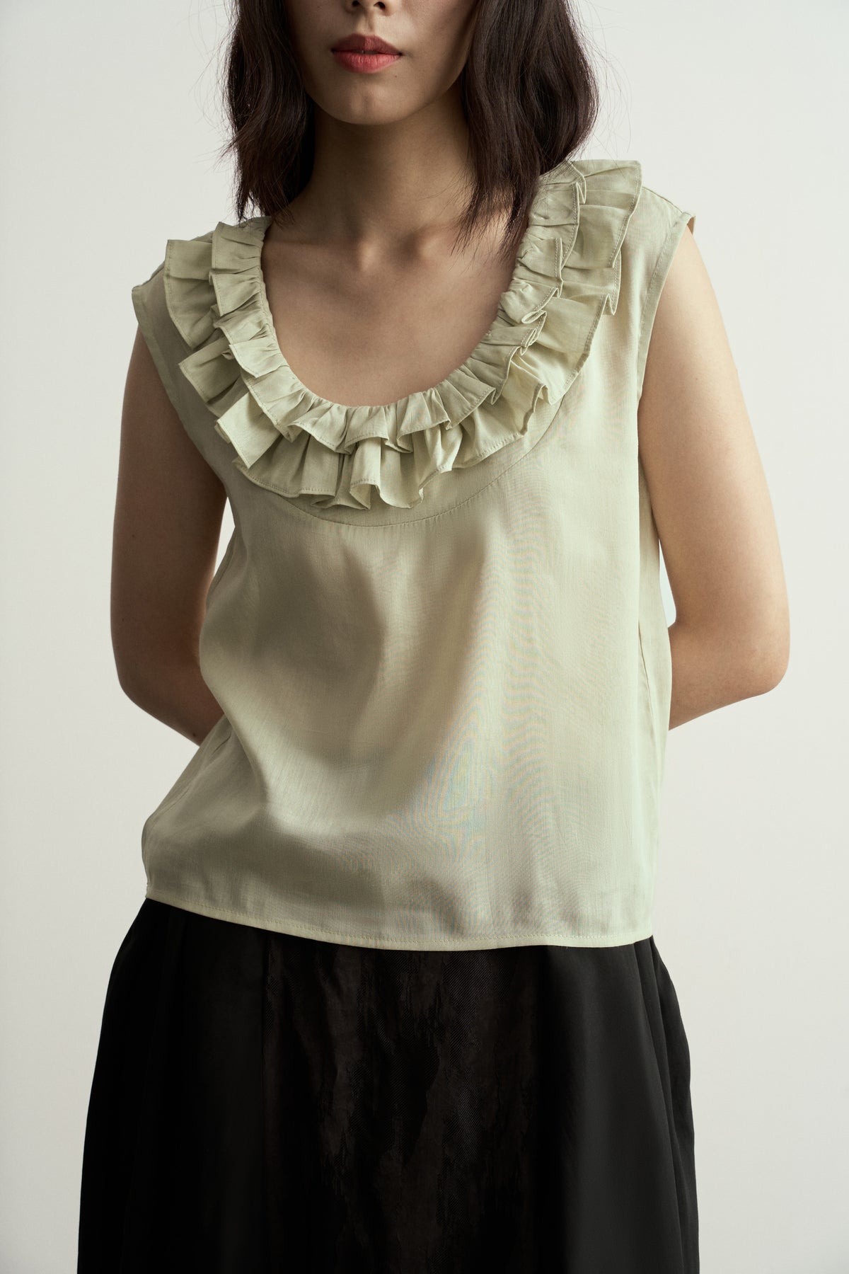 LIGHT GREEN LINEN SLEEVELESS TOP WITH DOUBLE RUFFLE NECKLINE