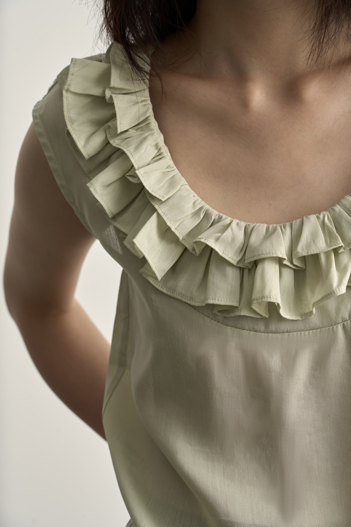 LIGHT GREEN LINEN SLEEVELESS TOP WITH DOUBLE RUFFLE NECKLINE